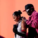 <aVideo: Jordan Chiles Gets Bronze Medal Clock from Flavor Flav After Tearful Interview