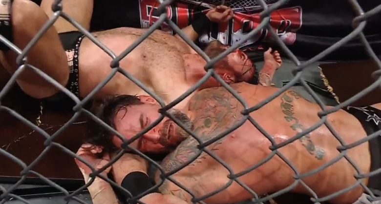 Video: CM Punk endures ruthless suplex through table to win bloody match in WWE