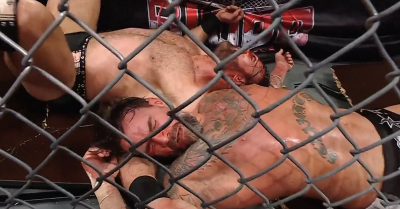 Video: CM Punk endures ruthless suplex through table to win bloody match in WWE