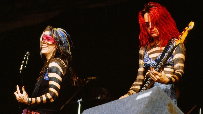 “The crowd got awful– they were simply being assholes, tossing mud at us the entire set, striking us hard on our bodies and on our guitars”: Donita Sparks informs the story of L7’s notorious set at 1992’s Reading Festival