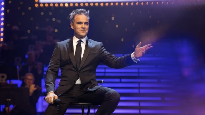 Film evaluation: ‘Better Man’ overthrows biopic with Robbie Williams beauty