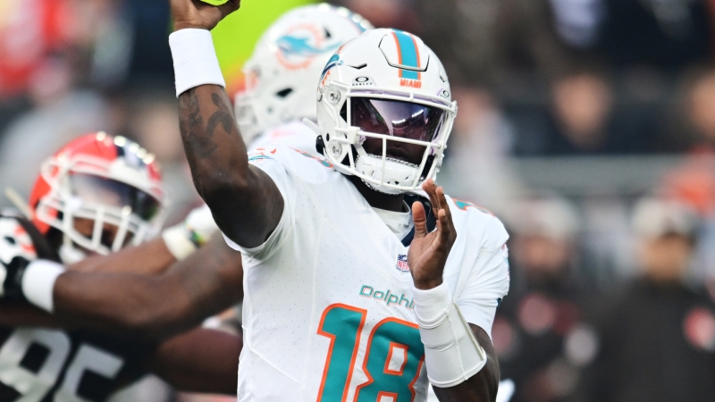 Short-handed Dolphins preserve slim playoff hopes with roadway win over Browns