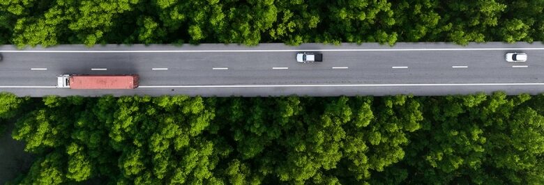 Collective transportation optimisation assists towards decarbonisation objectives